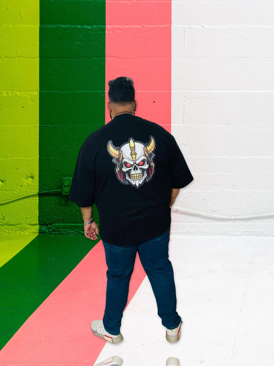 Man wearing a black oversized cotton T-shirt with a dropped shoulder and relaxed silhouette