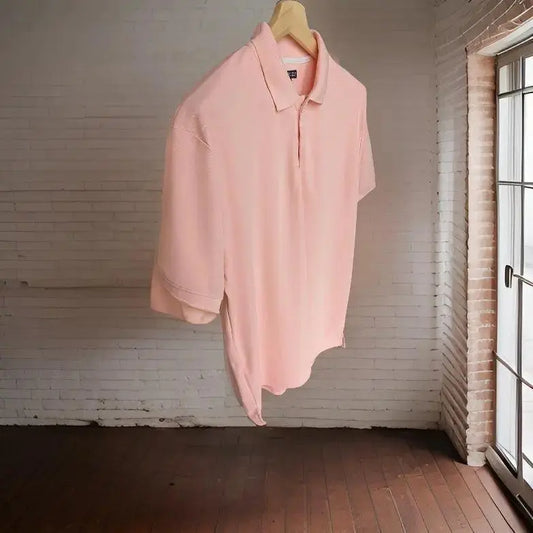 Premium Peach Lite Polo T-shirt on a hanger, with its full collar, sleeves and hem visible